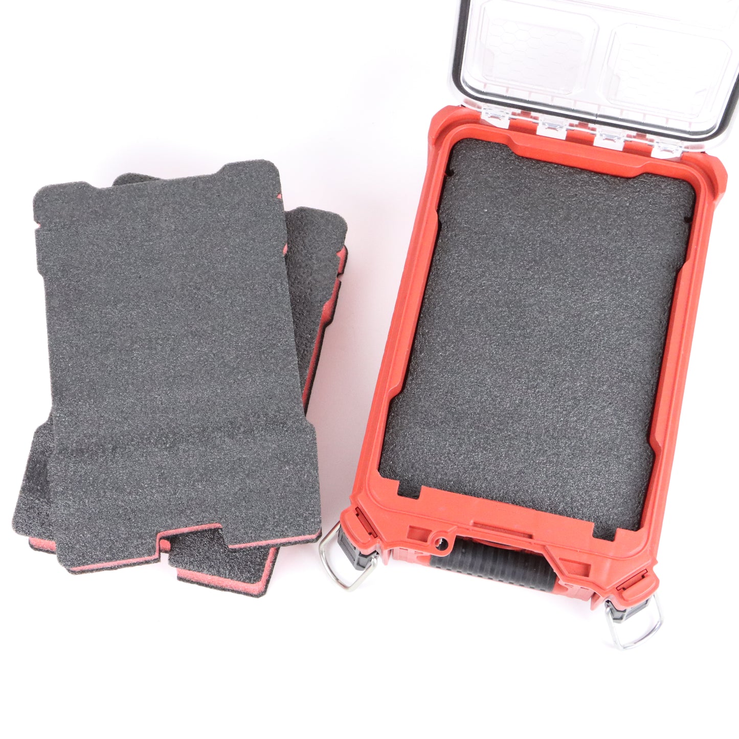 Black and layered EPE foam blanks beside an open compact tool organizer case